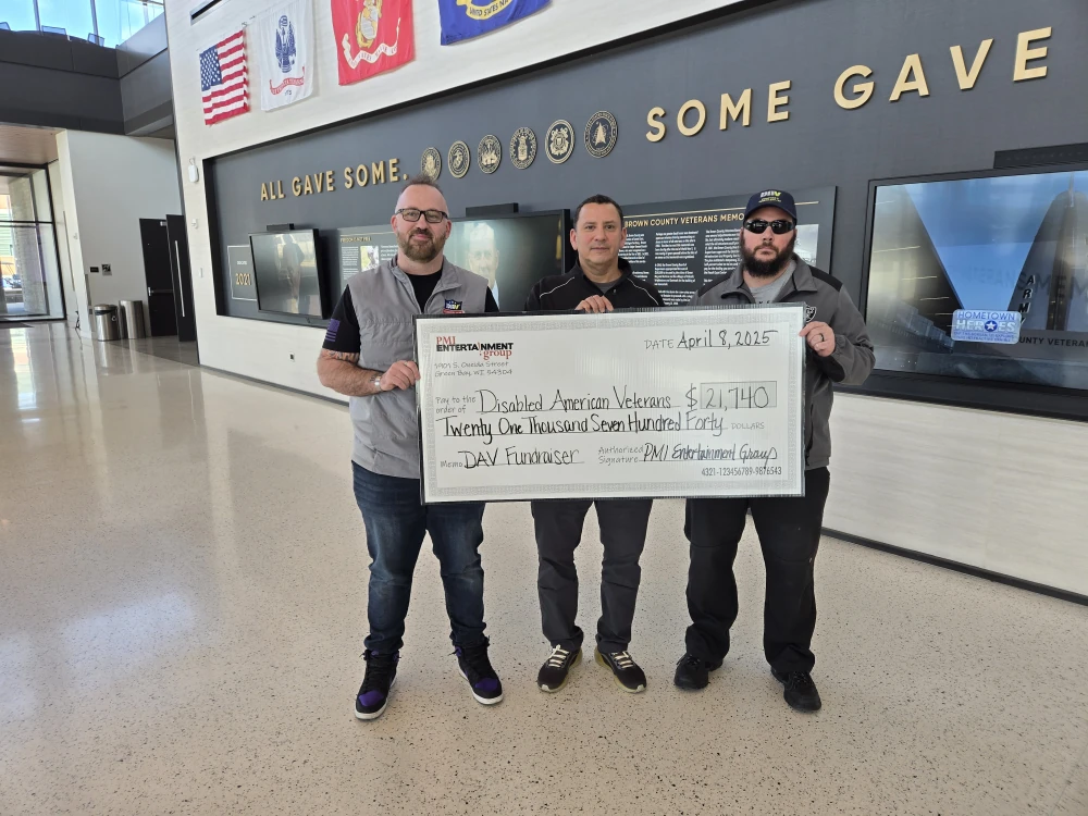  Chapter 3 Commander Daniel Diebold and Adjutant Matt Kempainen receiving a check from the Jersey Raffles at the Bart Starr Plaza Tailgate Party